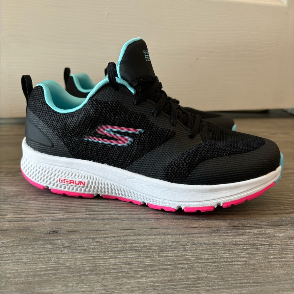 Skechers Go Run black sneakers with blue and pink accents, size 7
